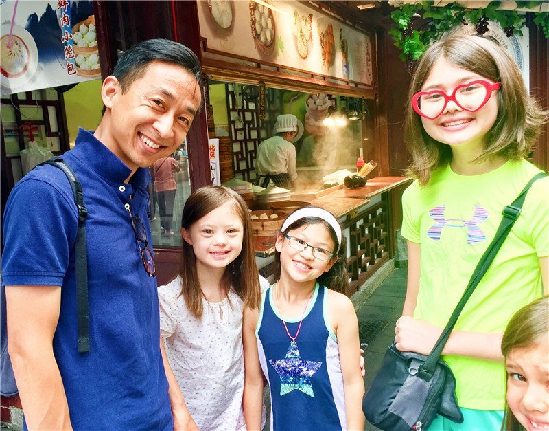 Tom with family travelers during a local food experience