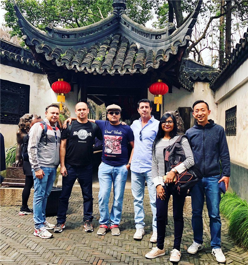 Tom with guests in Shanghai